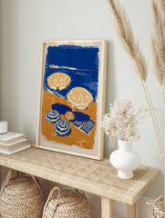 Blue and orange beach scene poster with two open umbrellas, two closed umbrellas, and a striped towel on the sand next to the ocean. - Image 4