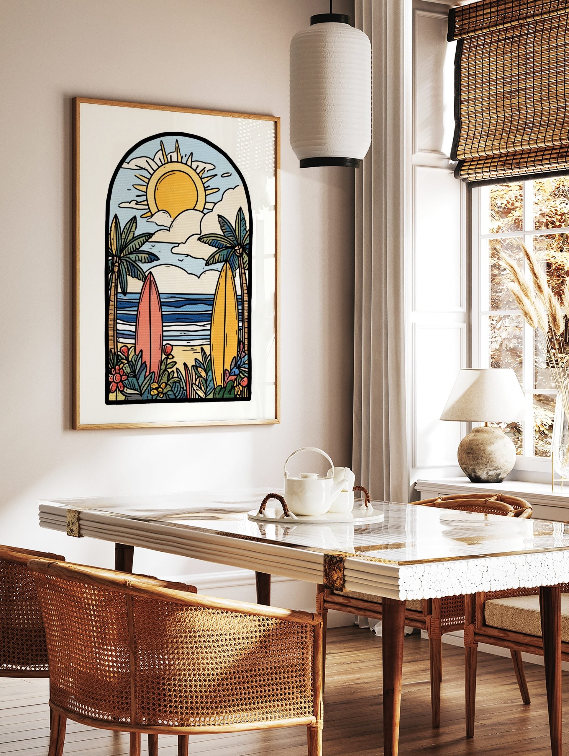 Illustrative beach scene art print with two surfboards, palm trees, ocean, sun, and clouds in an, in a styled room mockup