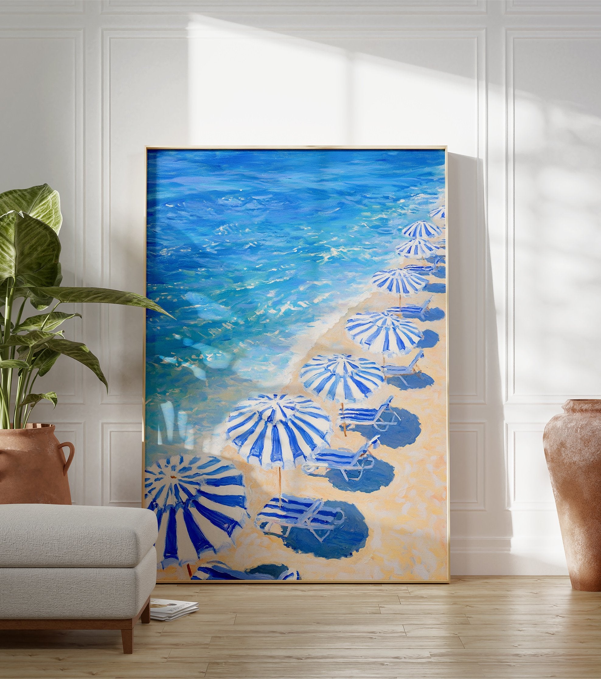 Blue Beach Umbrellas poster showing a painting of a sandy beach with striped umbrellas, lounge chairs, and blue ocean waves. - Image 3