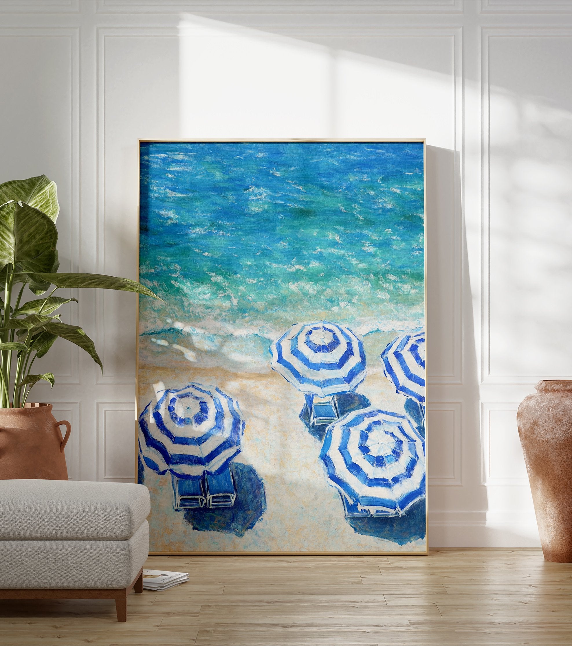 Blue and white striped beach umbrellas poster on a sandy beach next to turquoise ocean waves. - Image 3