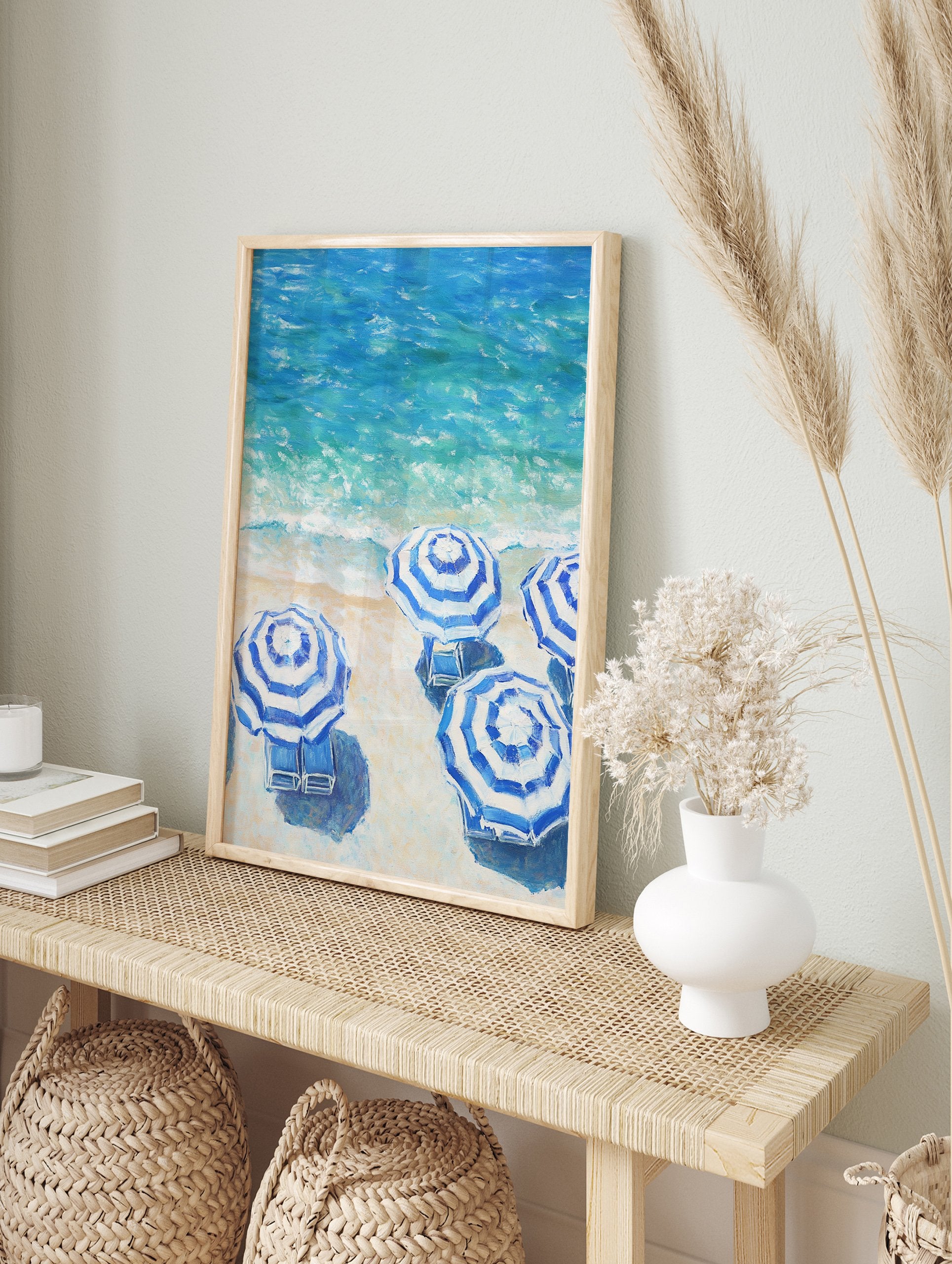 Blue and white striped beach umbrellas poster on a sandy beach next to turquoise ocean waves. - Image 4