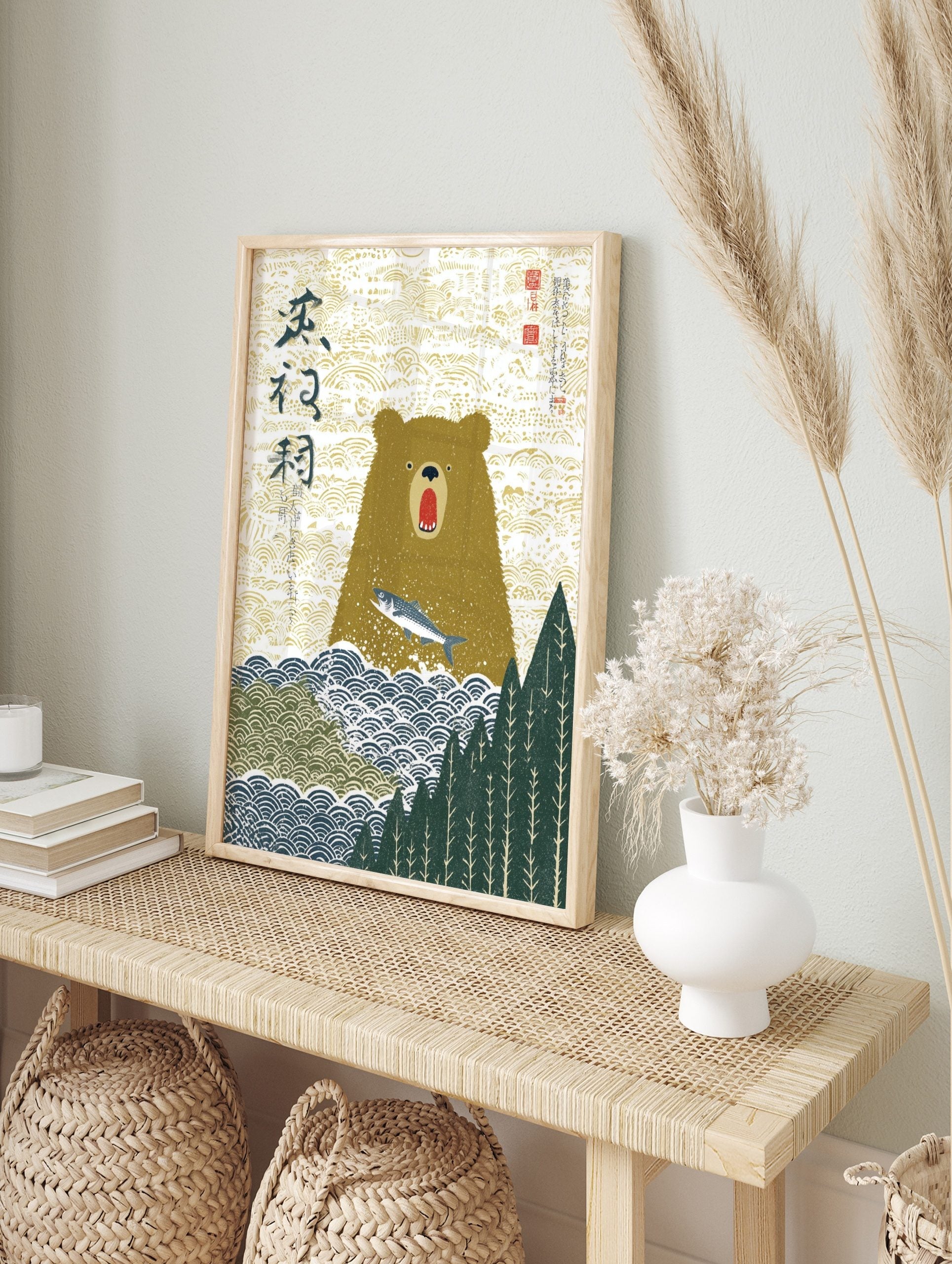 Illustrative Japanese art print of a brown bear with open mouth and leaping silver fish, with, in an alternate framed mockup