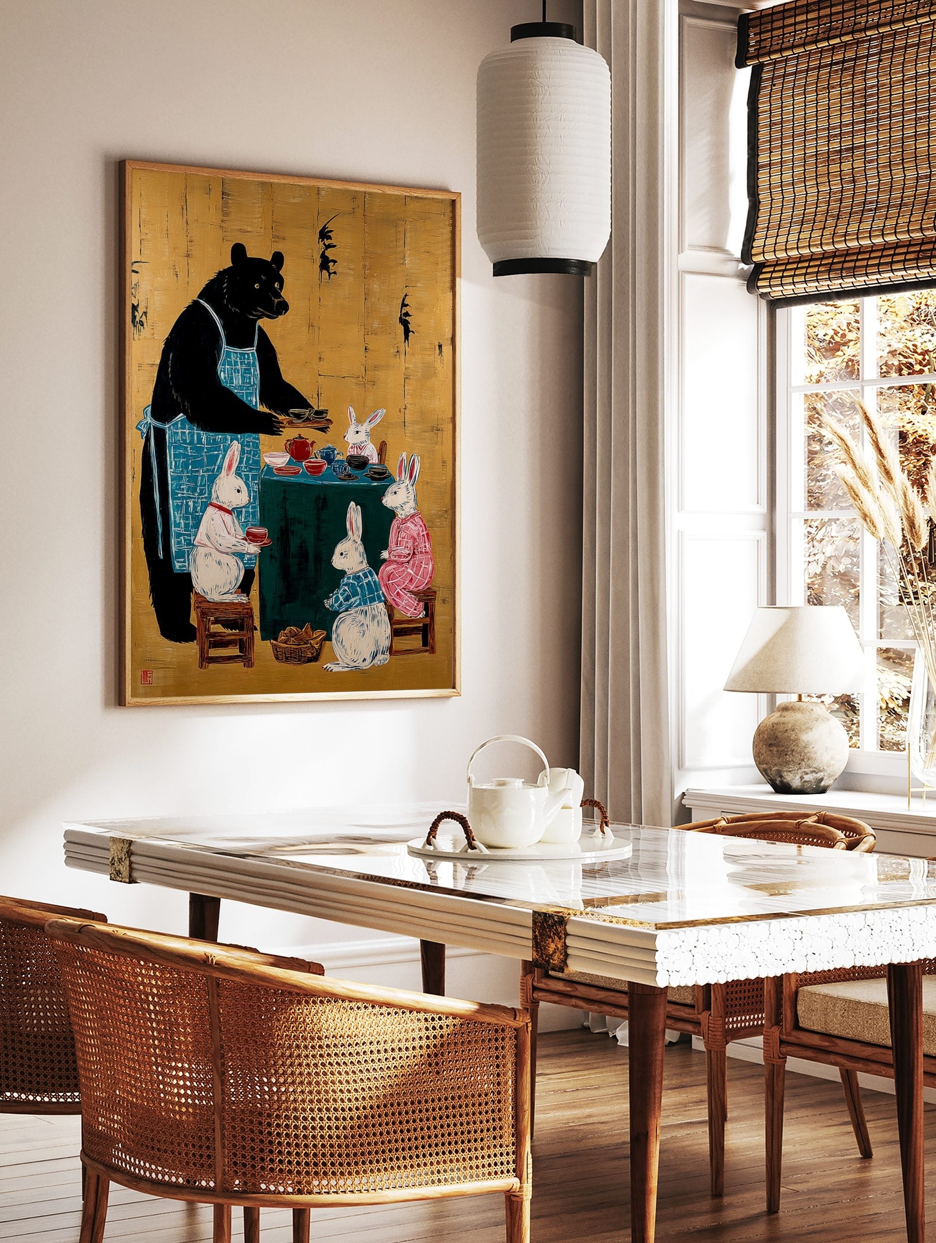 Black bear in blue apron serving tea to four white rabbits around a green table on a gold background, in a styled room mockup