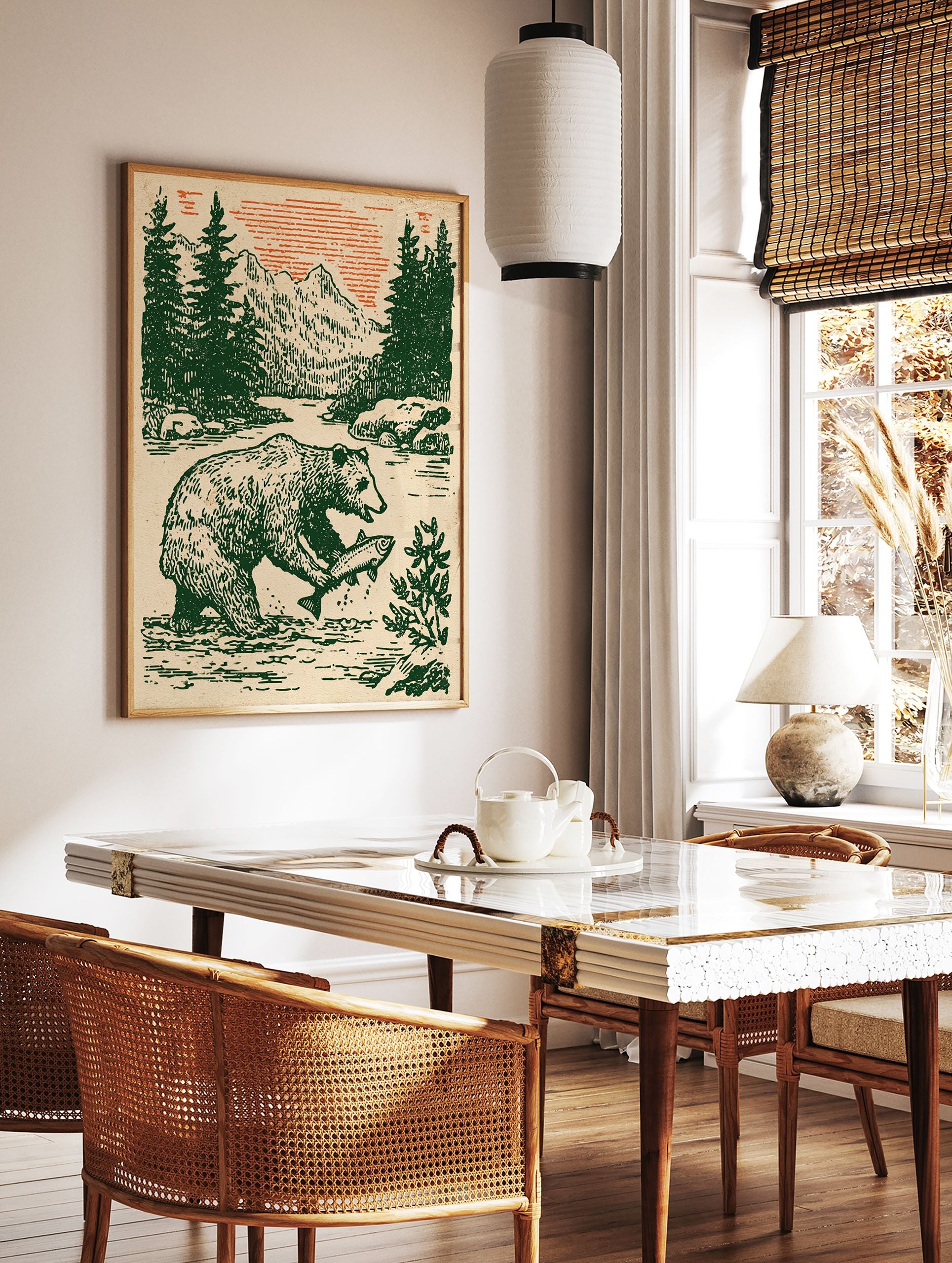 Vintage style illustration of a bear catching a fish in a river with pine trees, mountains, and an orange sky. Bear wall art. - Image 3