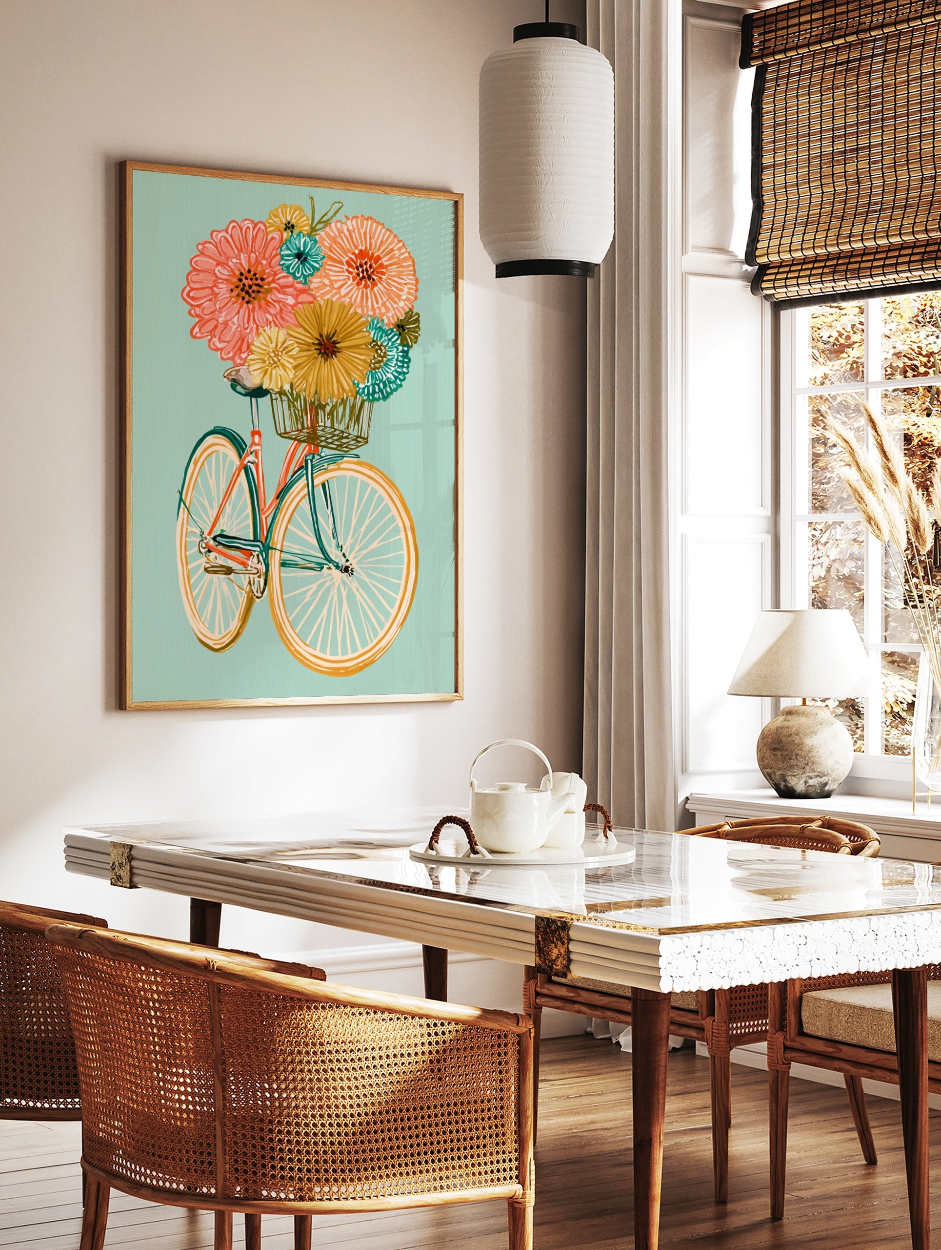 Illustrative bicycle with an orange frame and basket full of colourful flowers on a soft teal, in a styled room mockup