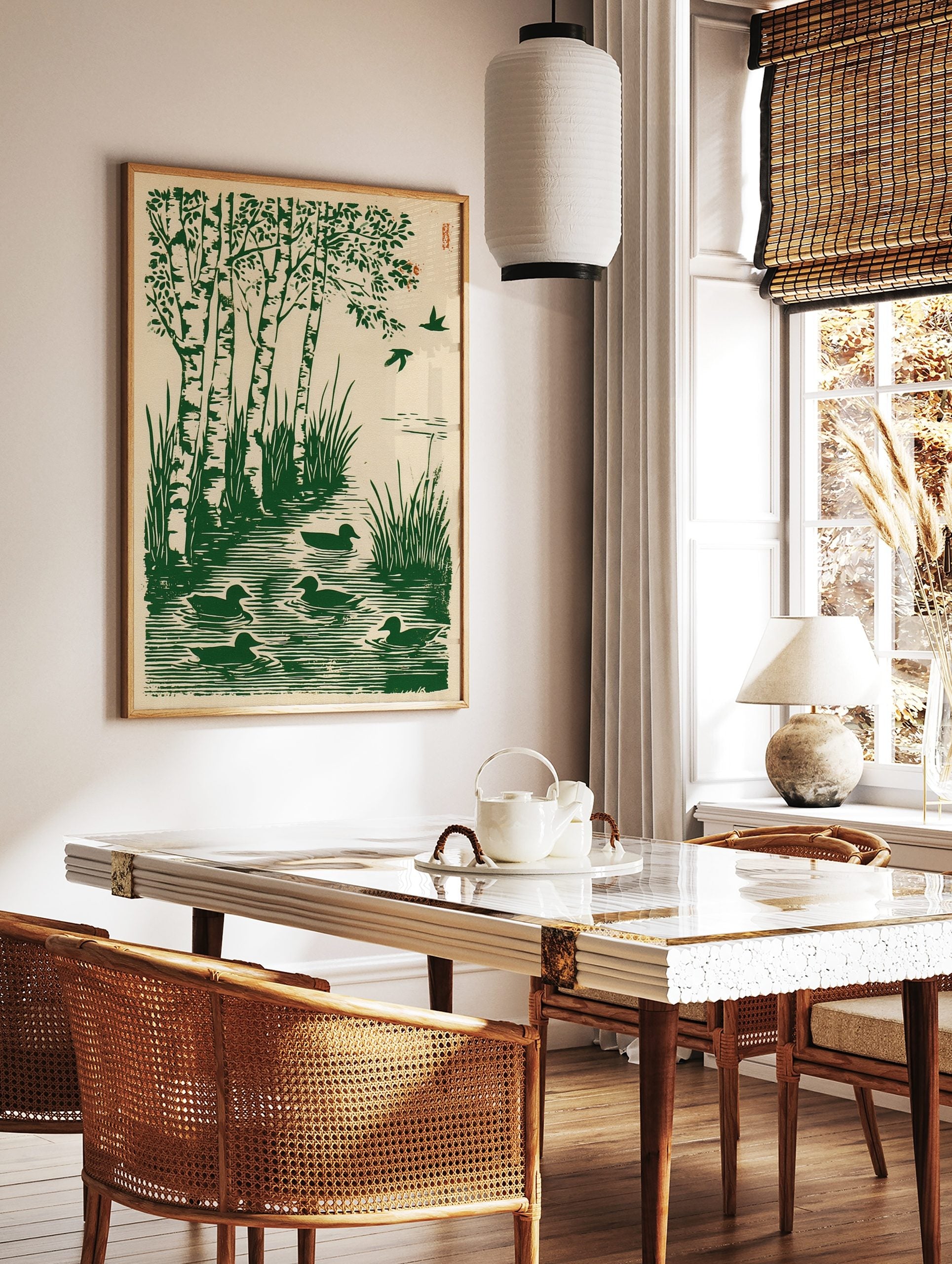 Green woodcut print of birch trees, tall grass, and five ducks swimming in water with two birds, in a styled room mockup