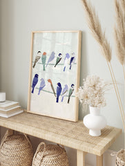 Illustrative bird wall art featuring a group of colorful songbirds perched on two wires against a pale green background - Image 3