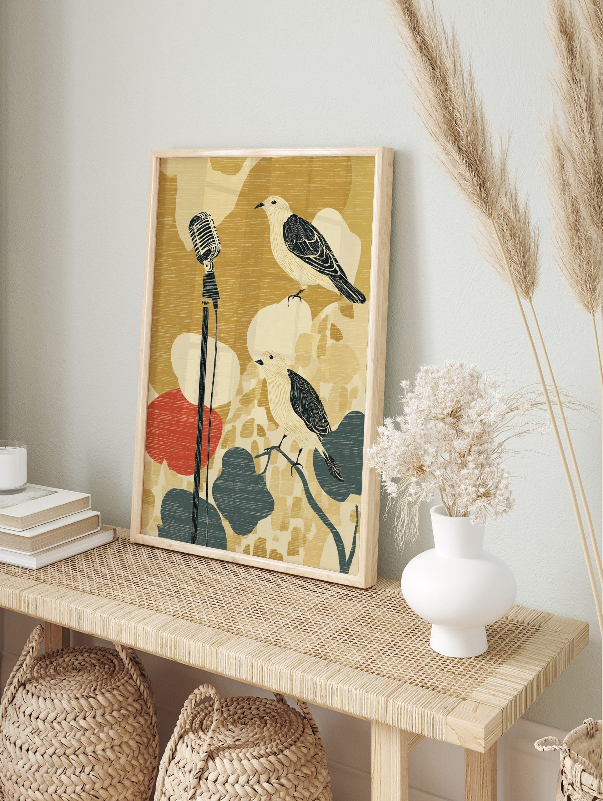 Illustrative wall art with two birds and a vintage microphone on a textured gold, red, and, in an alternate framed mockup