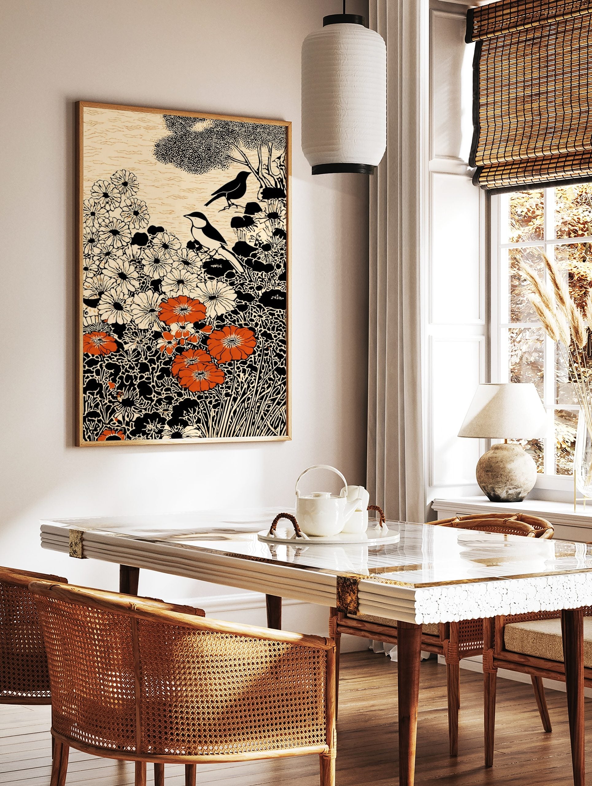 Illustrative art print with two birds, white and orange flowers, black foliage, and cream background, in a styled room mockup