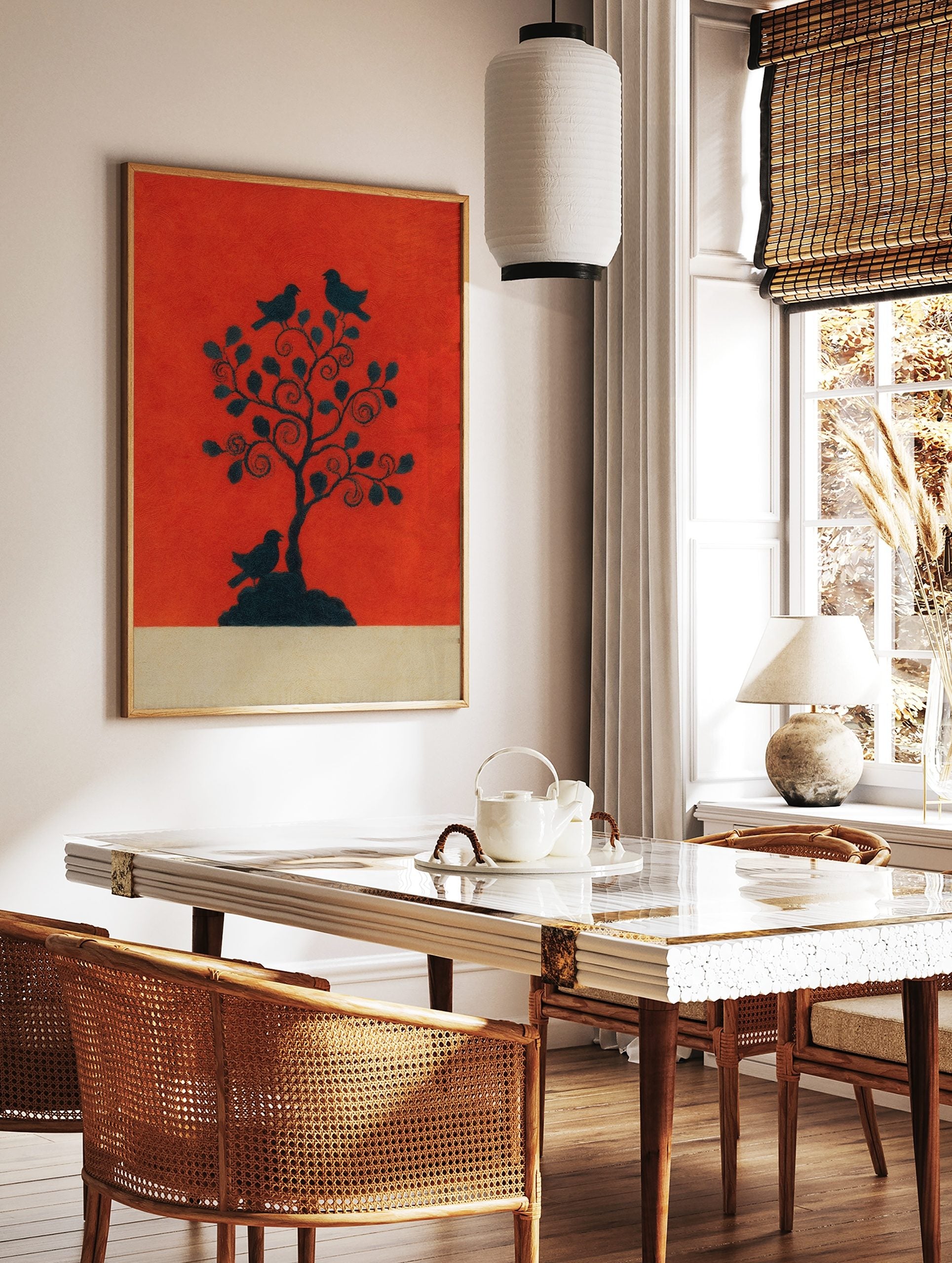 Black silhouette of a tree with three birds on a vibrant reddish-orange background, with a beige, in a styled room mockup