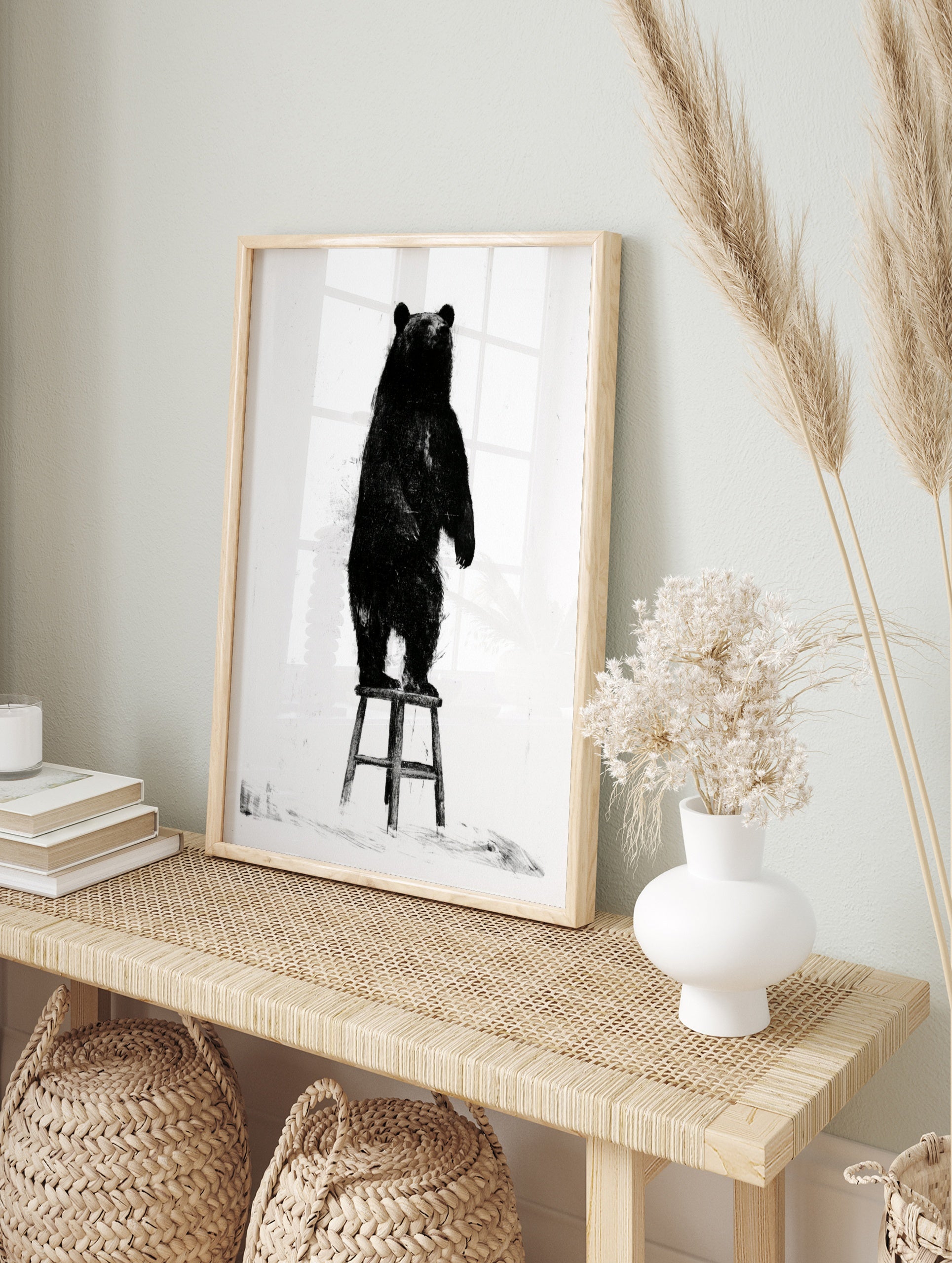 Black bear illustration standing on a wooden stool, monochrome art print on white background, in an alternate framed mockup