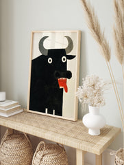 A black bull poster with large grey horns, white eyes, and a red mouth with sharp teeth and tongue against a white background. - Image 4