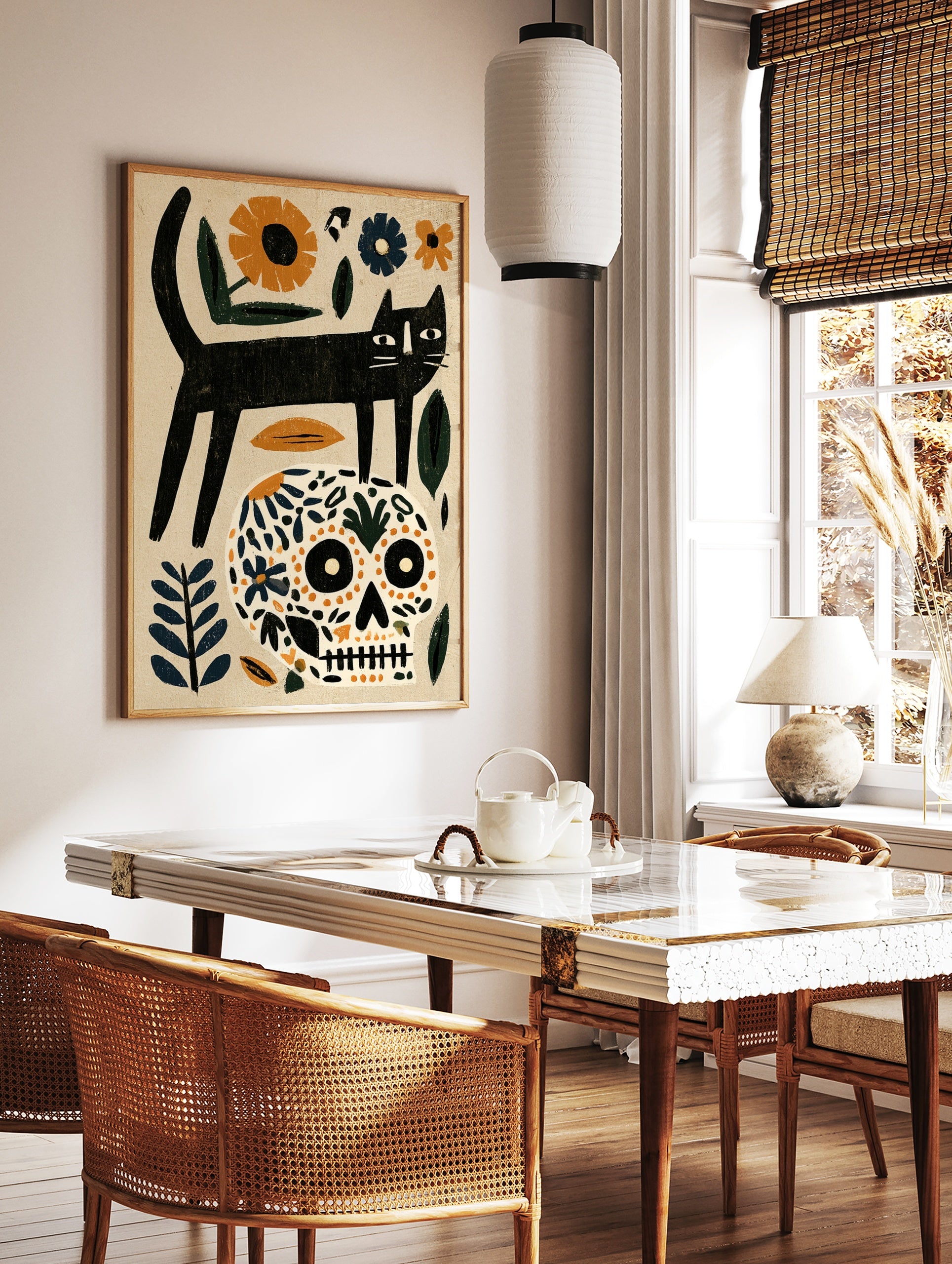 Black cat standing on a floral patterned skull with orange and blue botanical elements on a beige, in a styled room mockup
