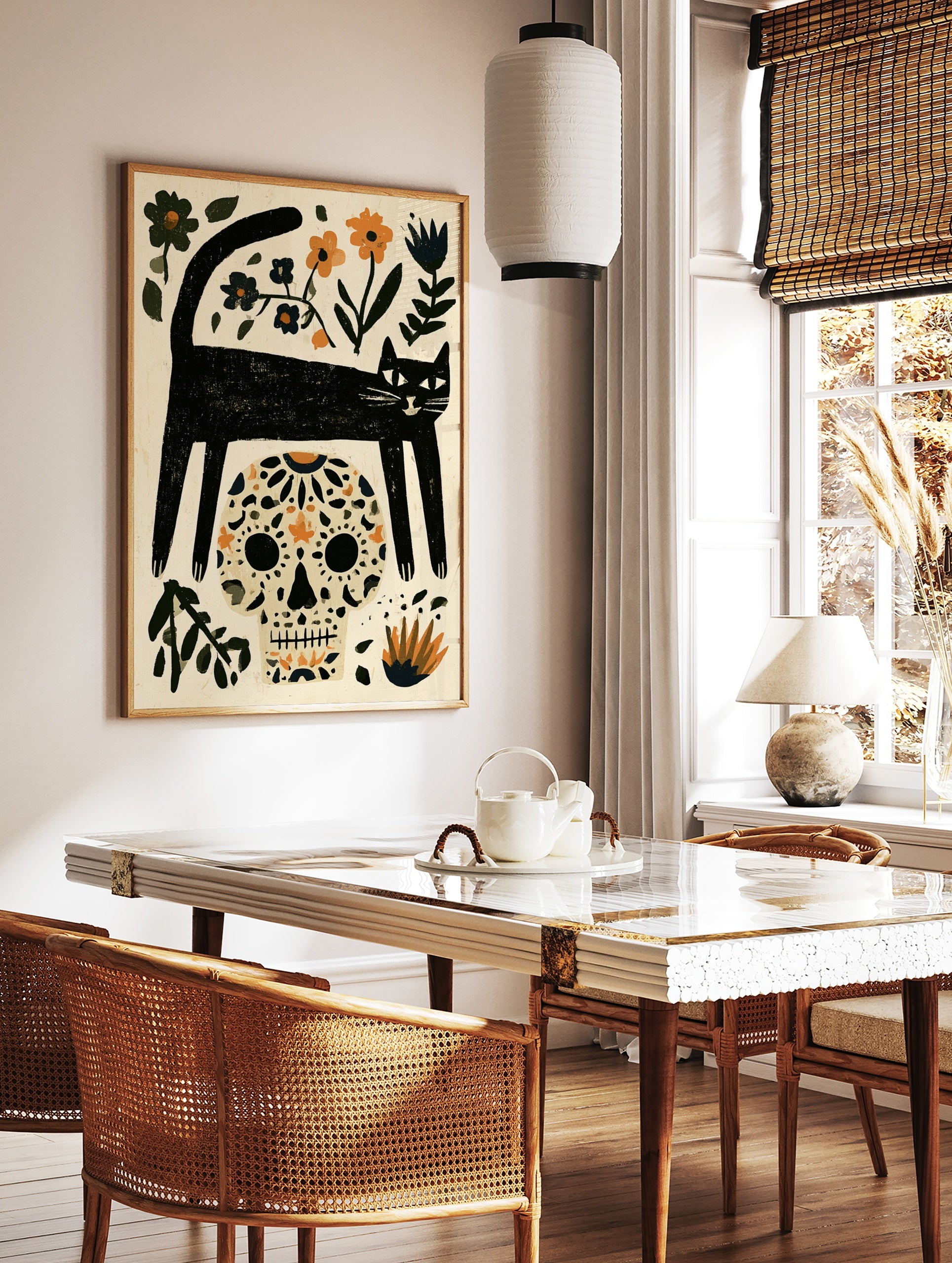Illustrative black cat and sugar skull wall art with orange and blue floral elements on a cream, in a styled room mockup
