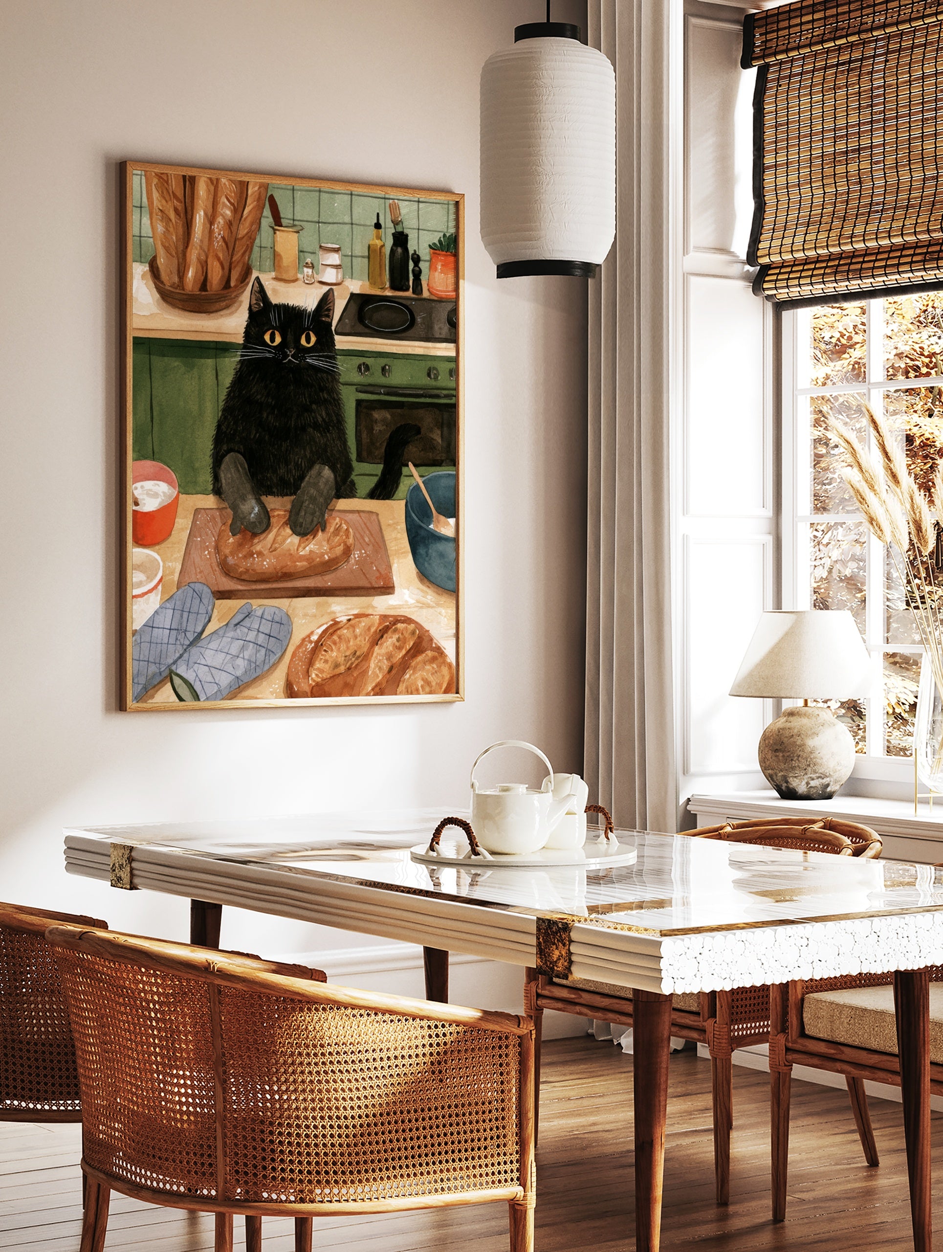 Illustration of a black cat wearing oven mitts kneading a loaf of bread on a wooden board in a, in a styled room mockup