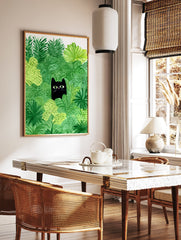 Whimsical black cat poster peeking through vibrant green jungle leaves with bright green eyes and a pink nose illustration. - Image 2