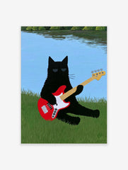 Black cat with sunglasses playing a red bass guitar in green grass by a blue lake illustrative wall art print