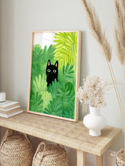Illustration poster of a black cat with big eyes peeking out from vibrant green foliage and leaves. - Image 4