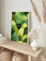 Black cat poster peeking from dense green jungle foliage with wide white eyes, in a whimsical illustration style. - Image 4