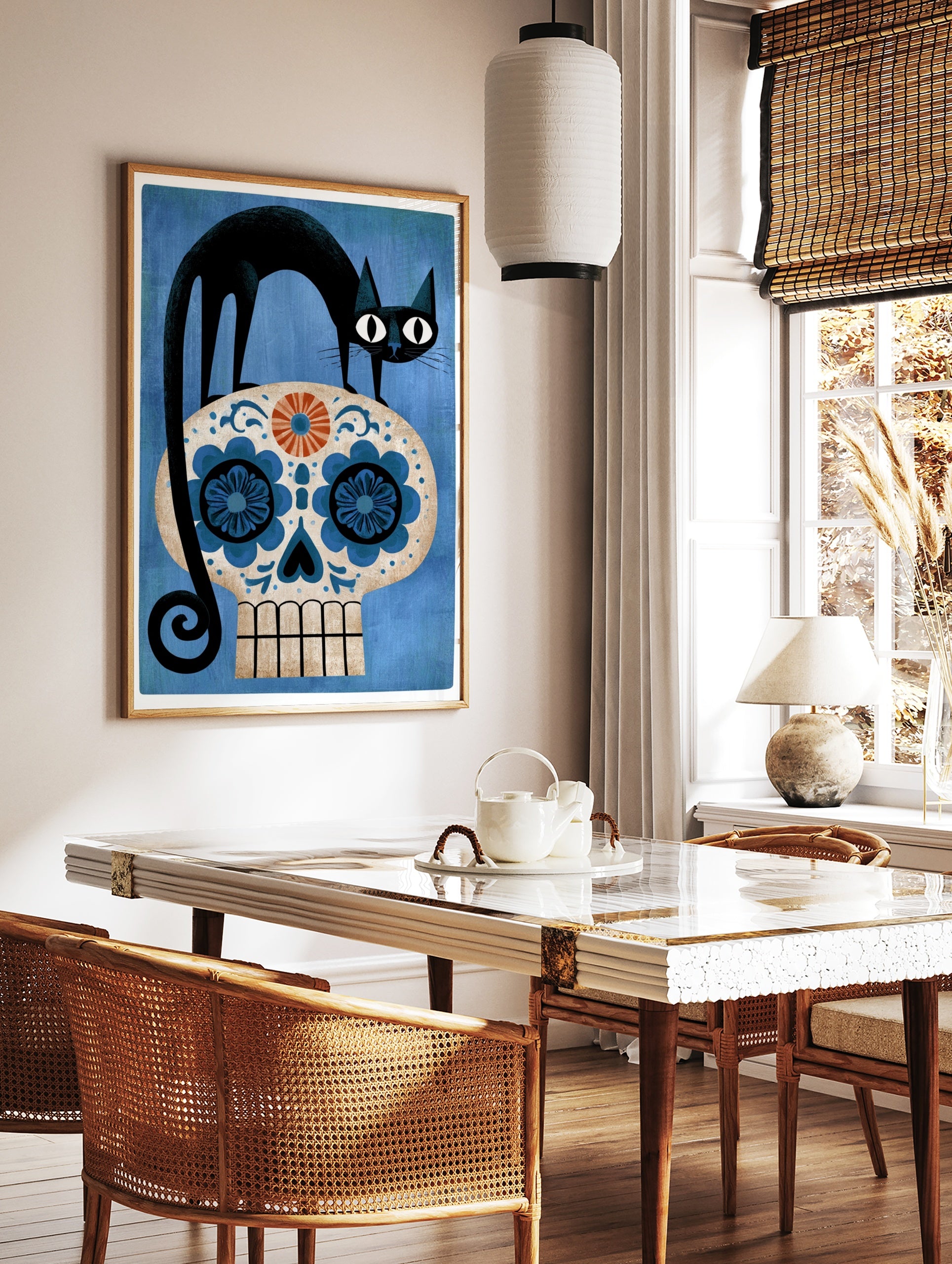 Black cat standing on a decorative blue and orange sugar skull floral illustration on a textured, in a styled room mockup