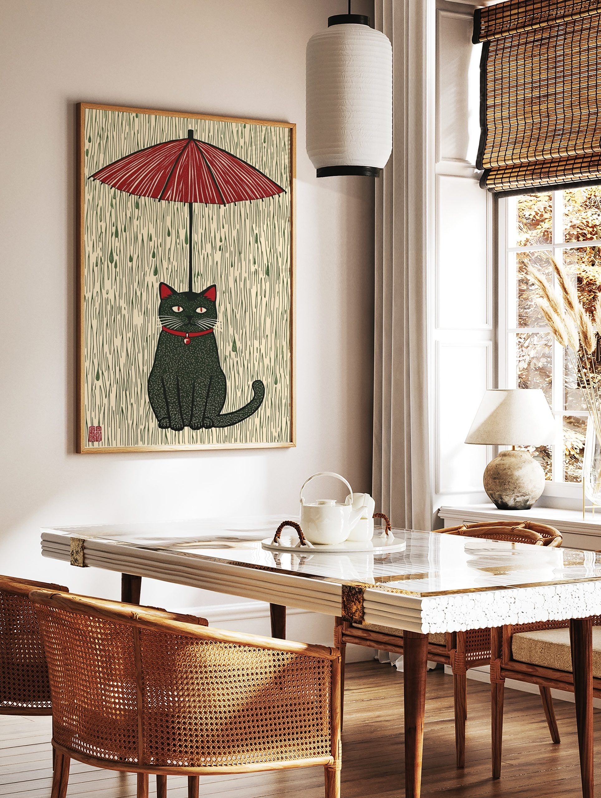 Stylised black cat with red collar and eyes sitting under a red umbrella in green rain, Japanese, in a styled room mockup