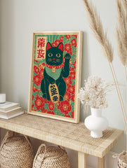 Black Maneki-neko lucky cat print with raised paw, holding a gold coin, against red floral, in an alternate framed mockup
