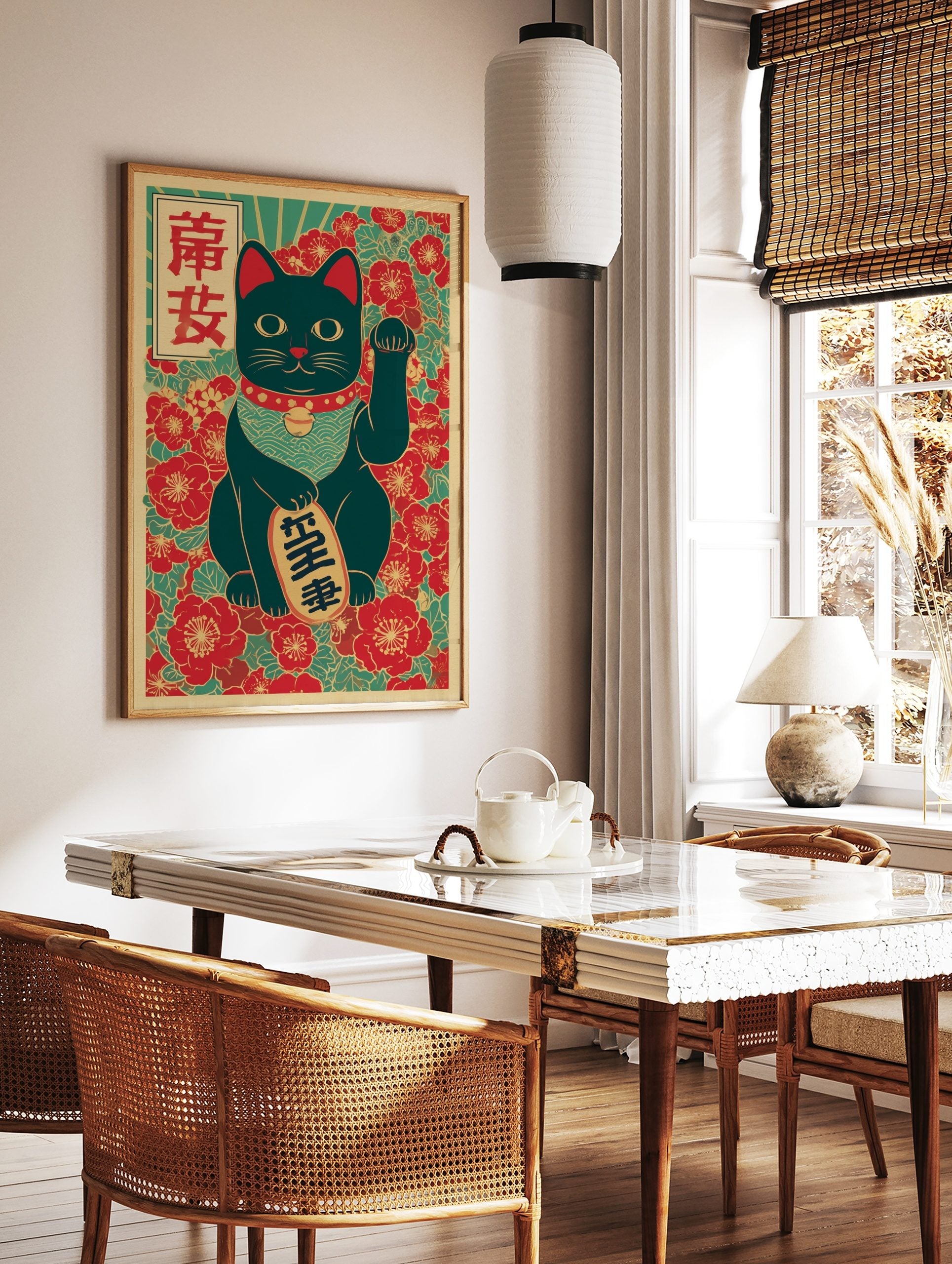 Black Maneki-neko lucky cat print with raised paw, holding a gold coin, against red floral and teal, in a styled room mockup