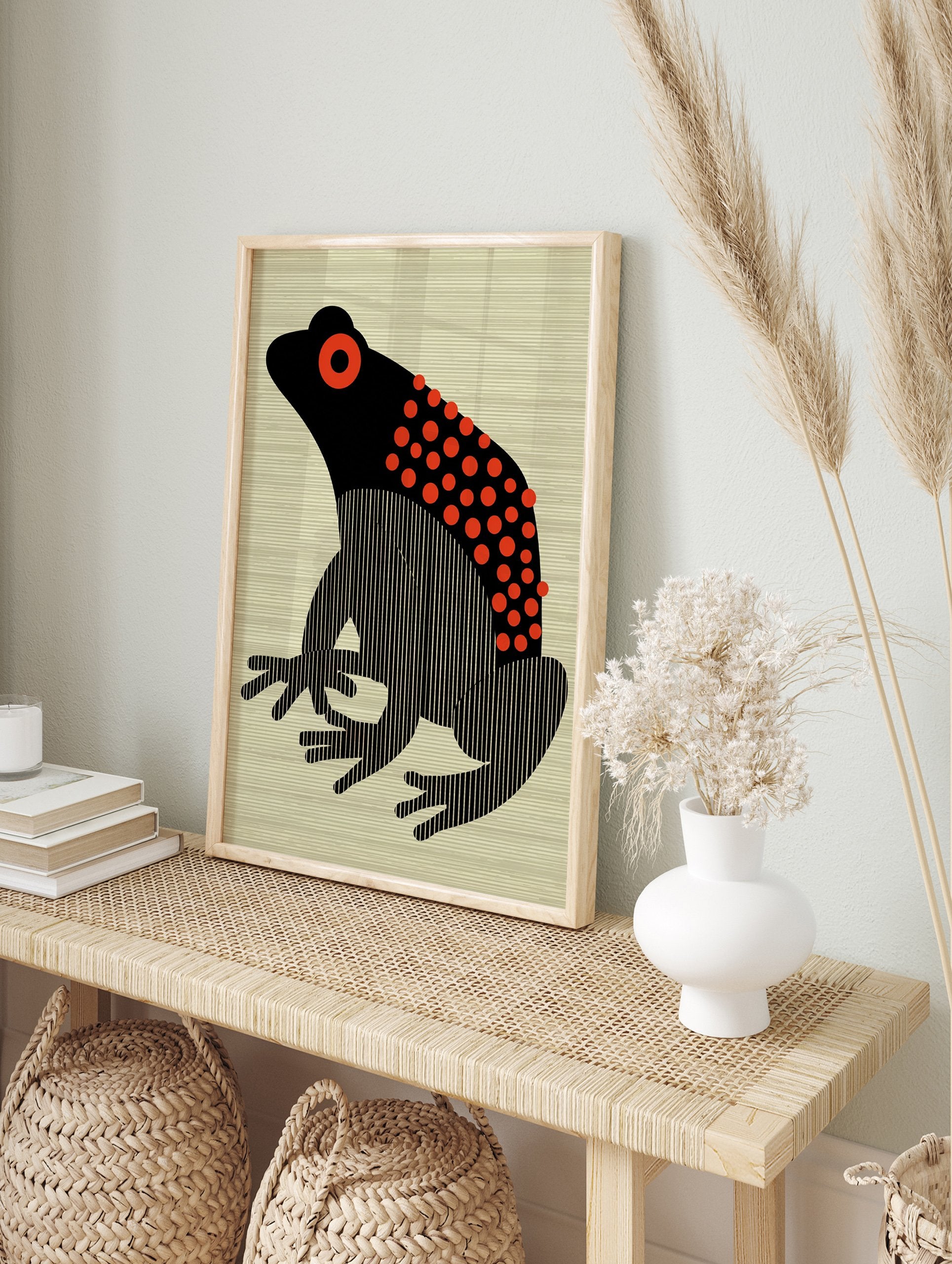 Black and red frog poster with stylized body, red polka dots, and vertical stripes, on a light beige striped background. - Image 4
