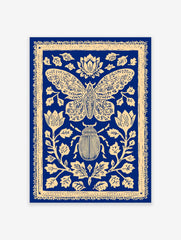 Blue and cream illustrative print of a moth and beetle surrounded by ornate botanical flowers and leaves