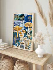 Blue and gold mushroom botanical collage art print with various fungi and patterned, in an alternate framed mockup
