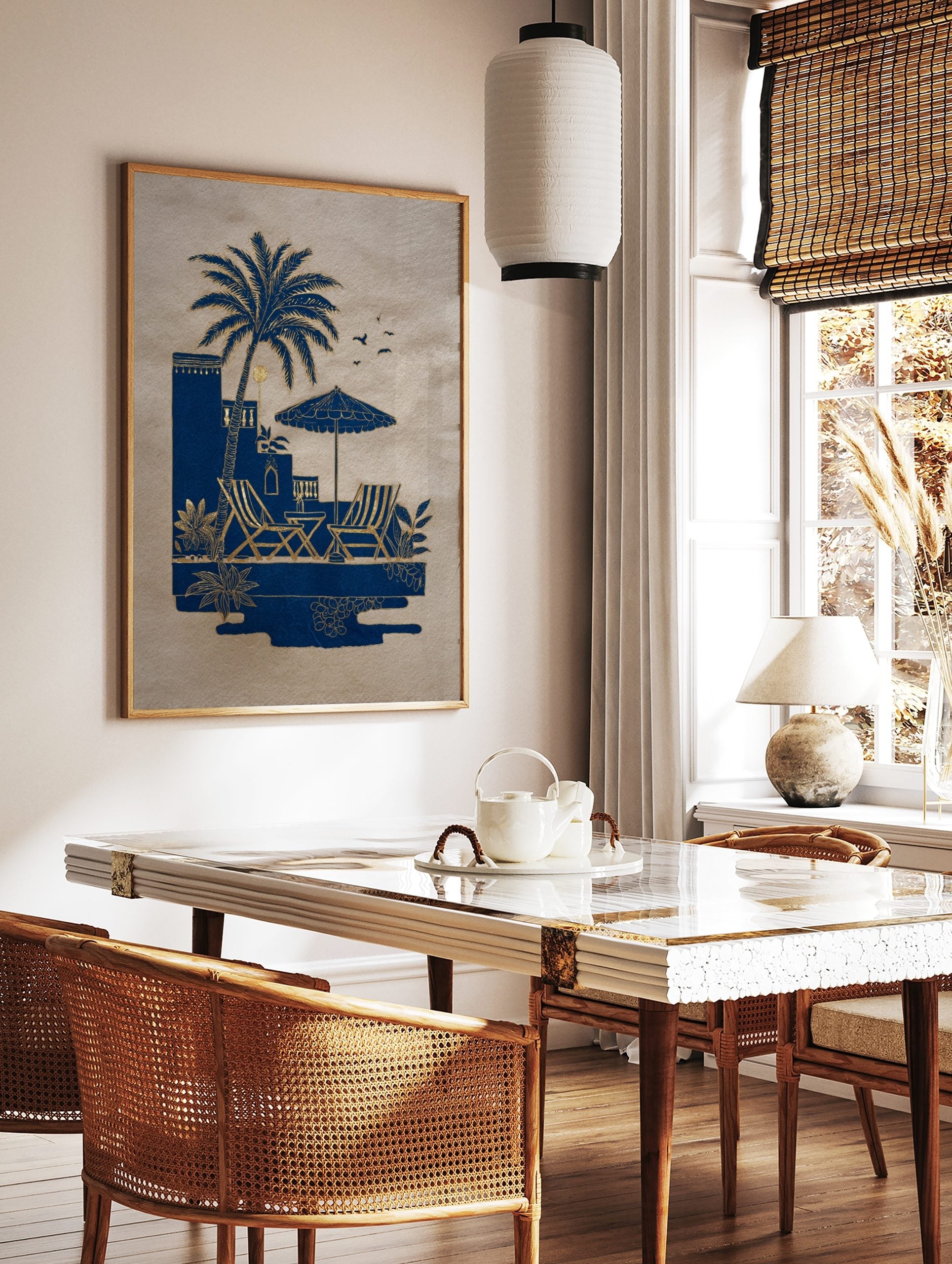 Blue and gold illustrative art print of a palm tree, deck chairs, and parasol by a pool on beige, in a styled room mockup