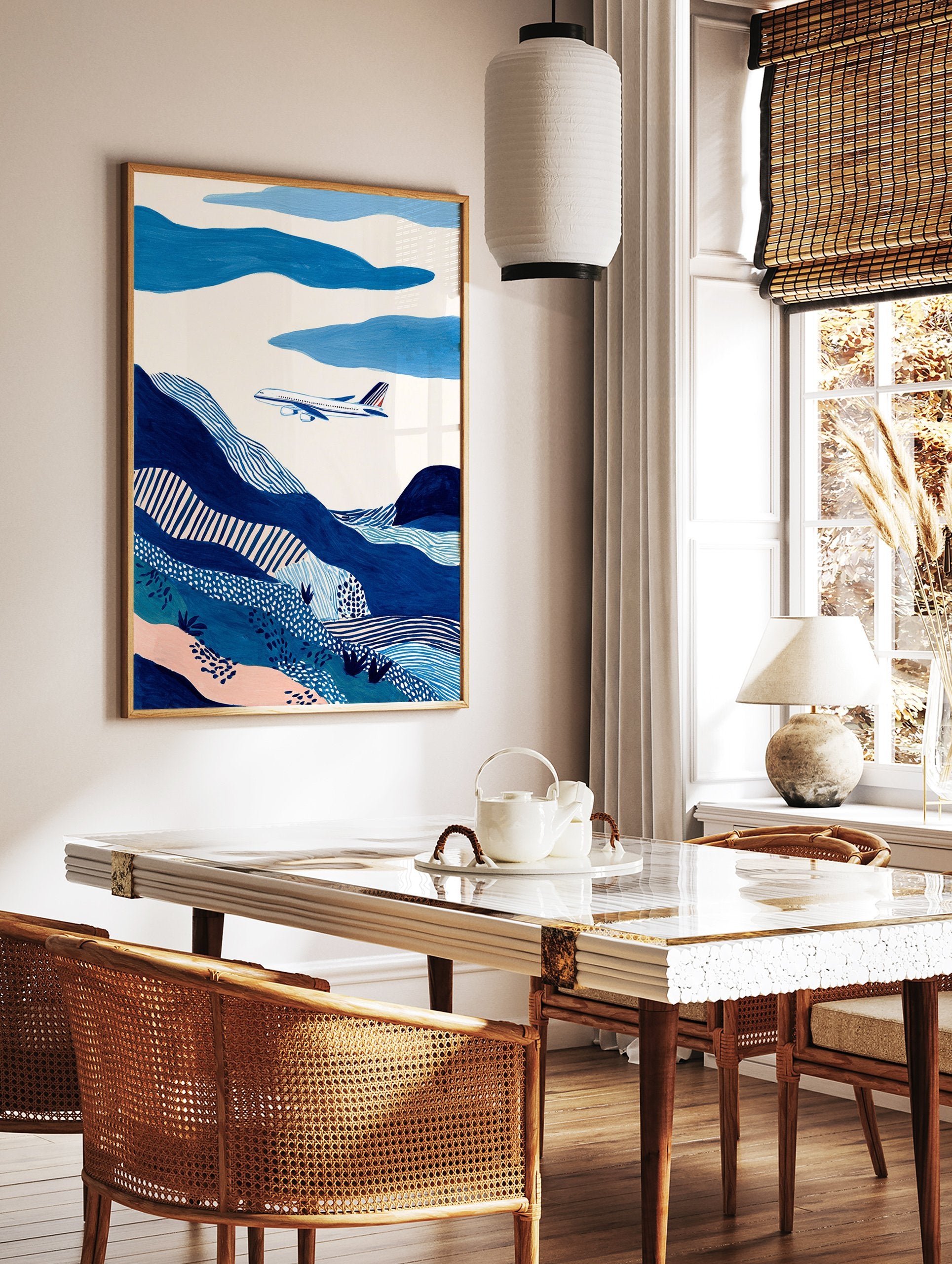 Abstract blue landscape wall art featuring an airplane flying over patterned hills and clouds in shades of blue and white. - Image 2