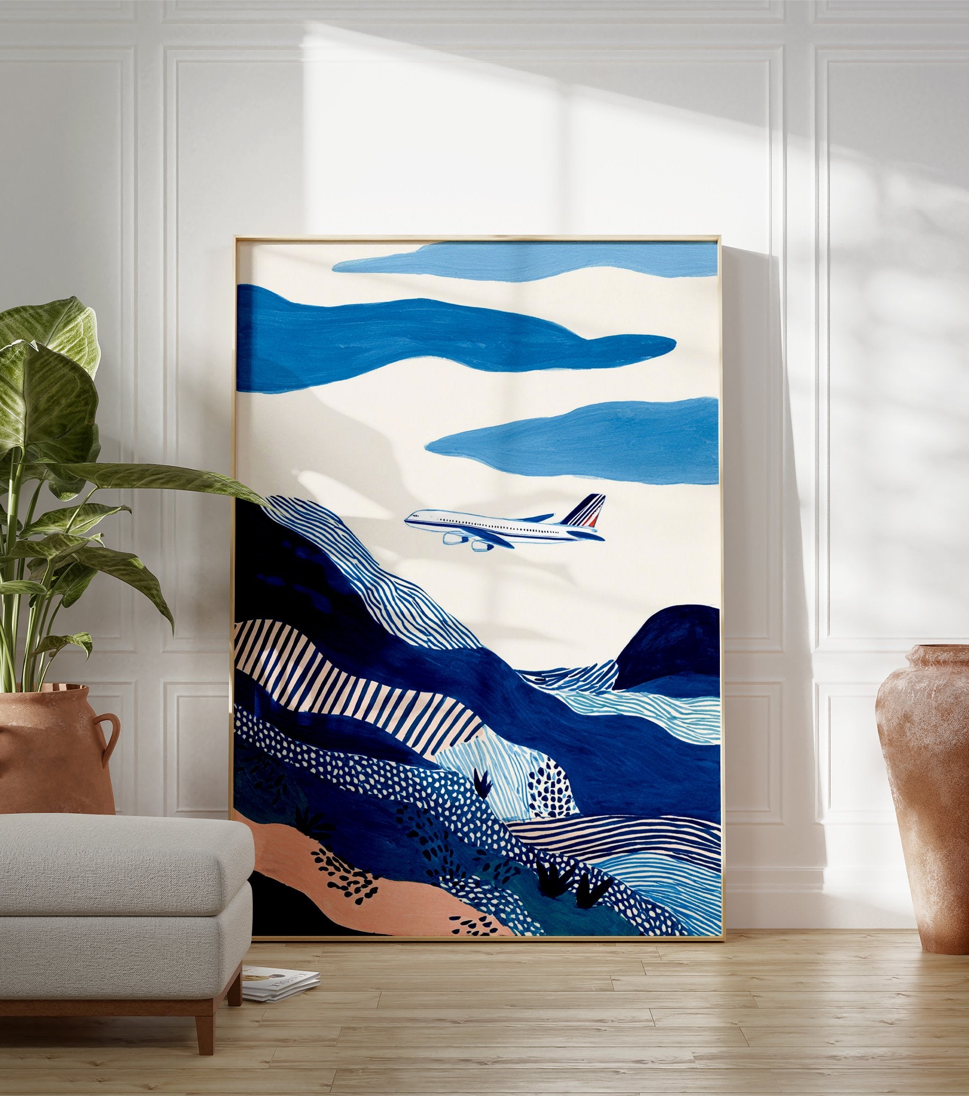 Abstract blue landscape wall art featuring an airplane flying over patterned hills and clouds in shades of blue and white. - Image 3