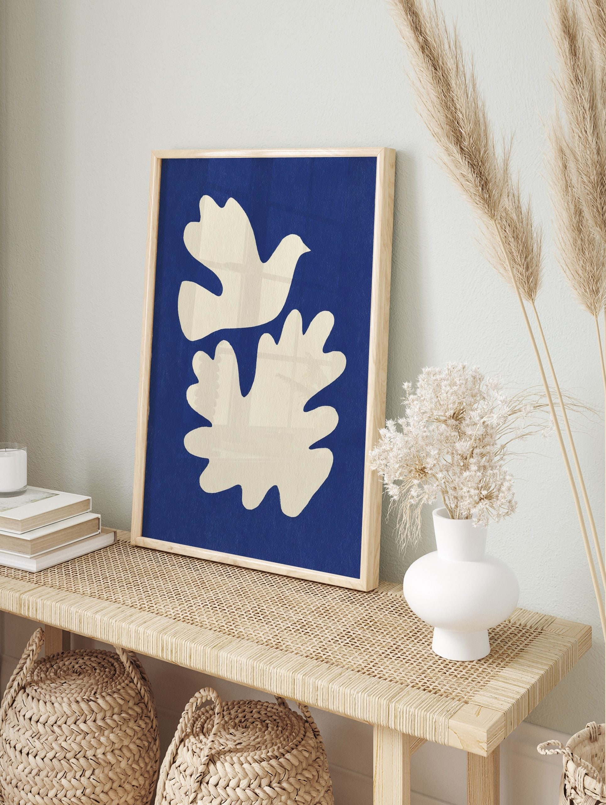 White dove and organic abstract shape on a textured deep blue background, unframed print, in an alternate framed mockup
