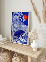 Blue beetle with golden details among white botanical line art, deep blue background, red sun, in an alternate framed mockup