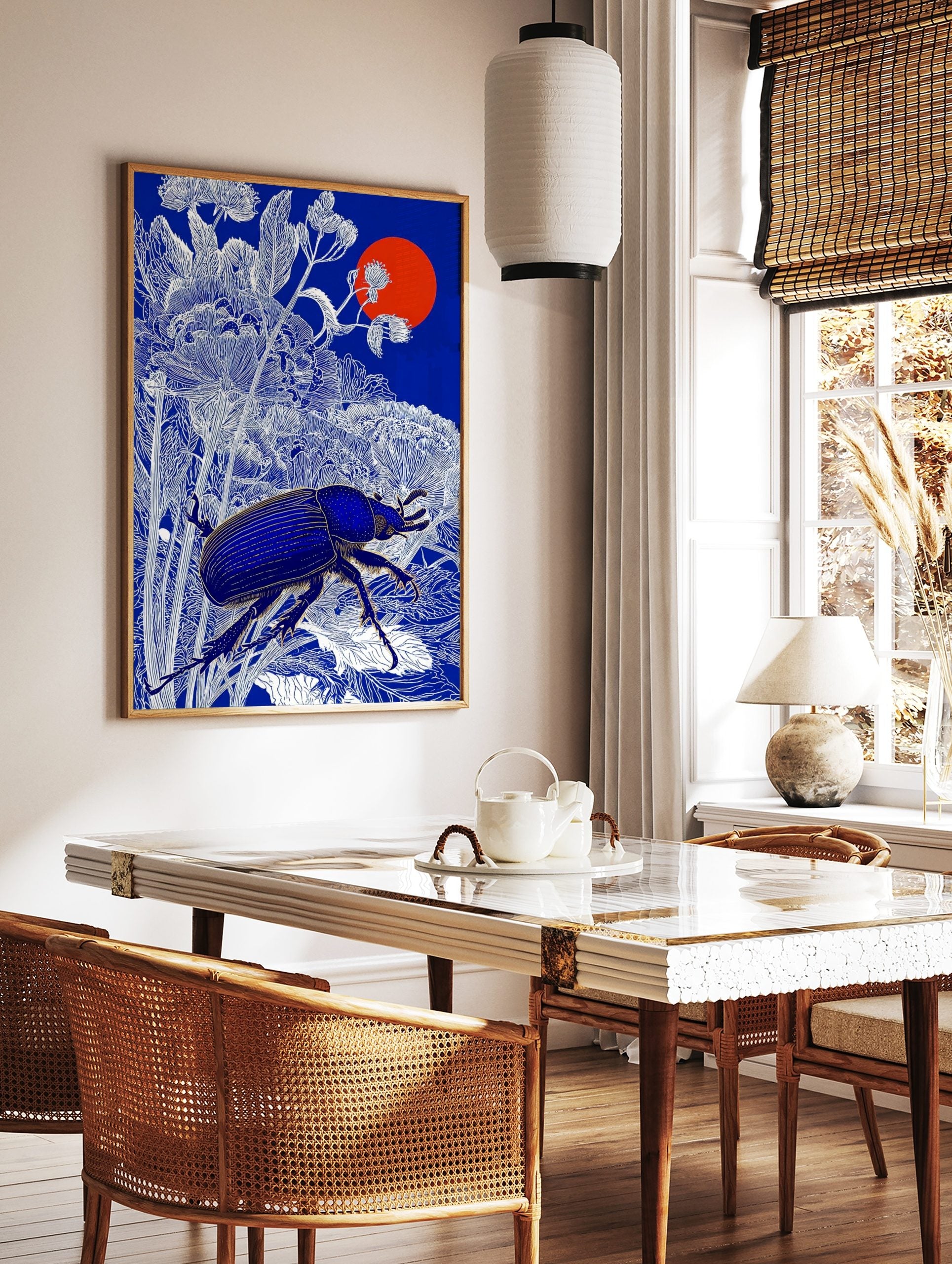 Blue beetle with golden details among white botanical line art, deep blue background, red sun, in a styled room mockup