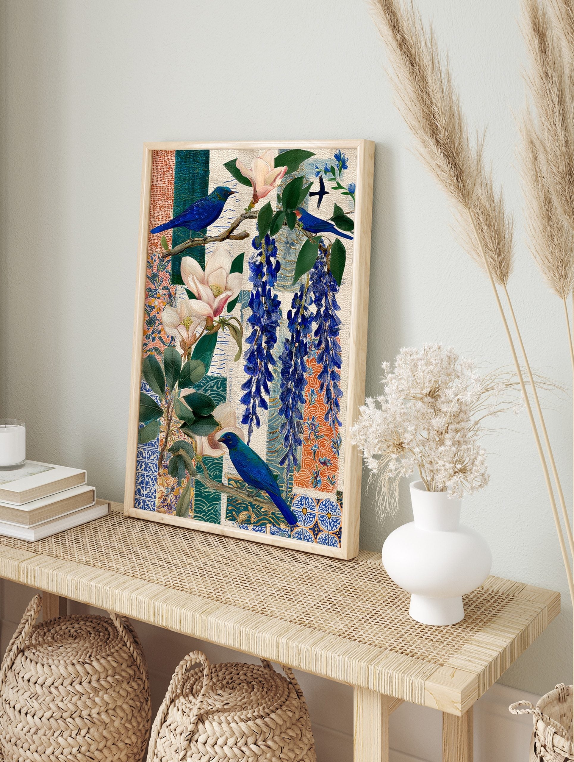 Blue bird with magnolia flowers and blue wisteria on patterned collage background, unframed, in an alternate framed mockup
