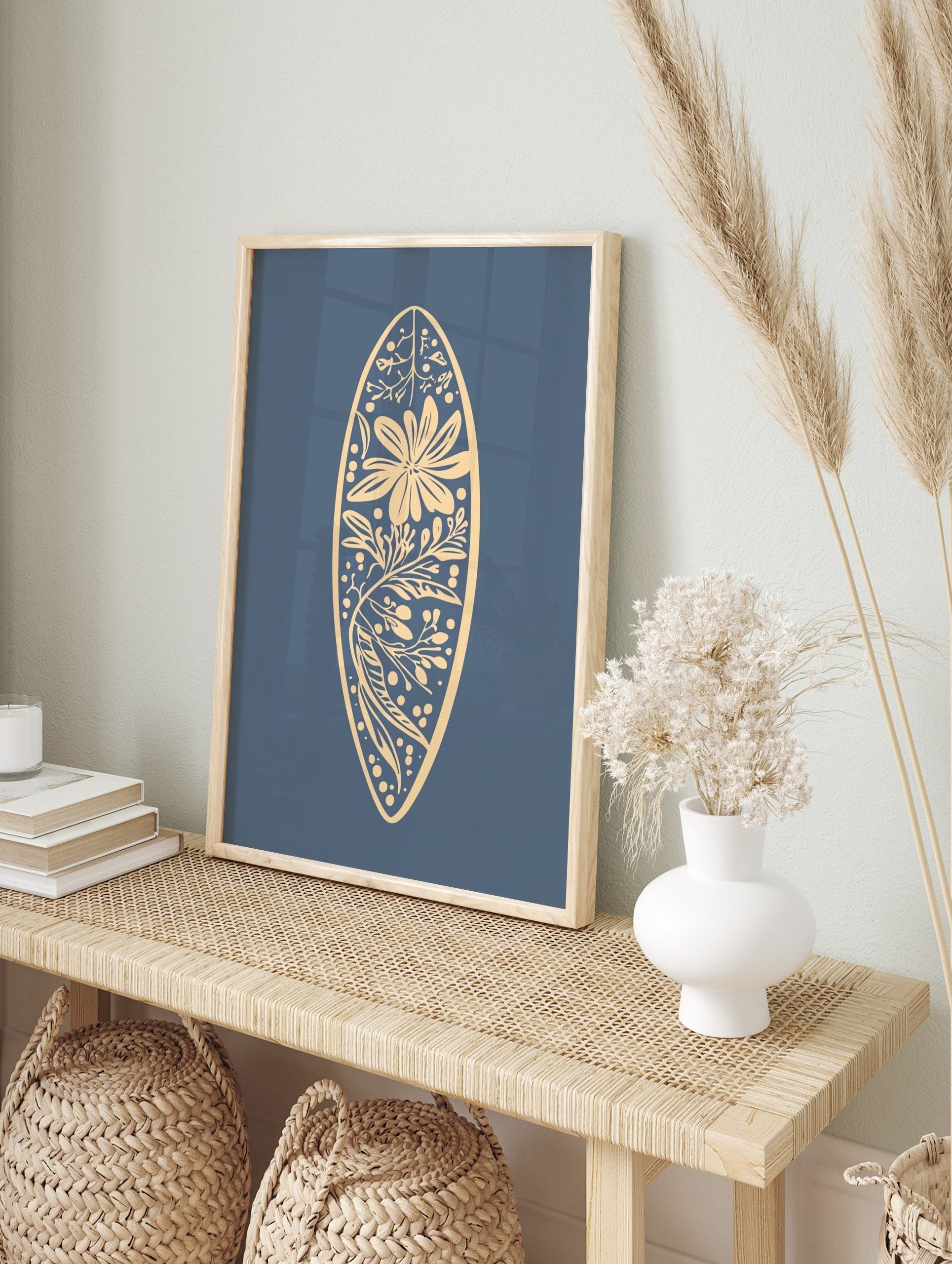 Botanical illustration in a surfboard shape with a large flower, leaves, and berries on a, in an alternate framed mockup