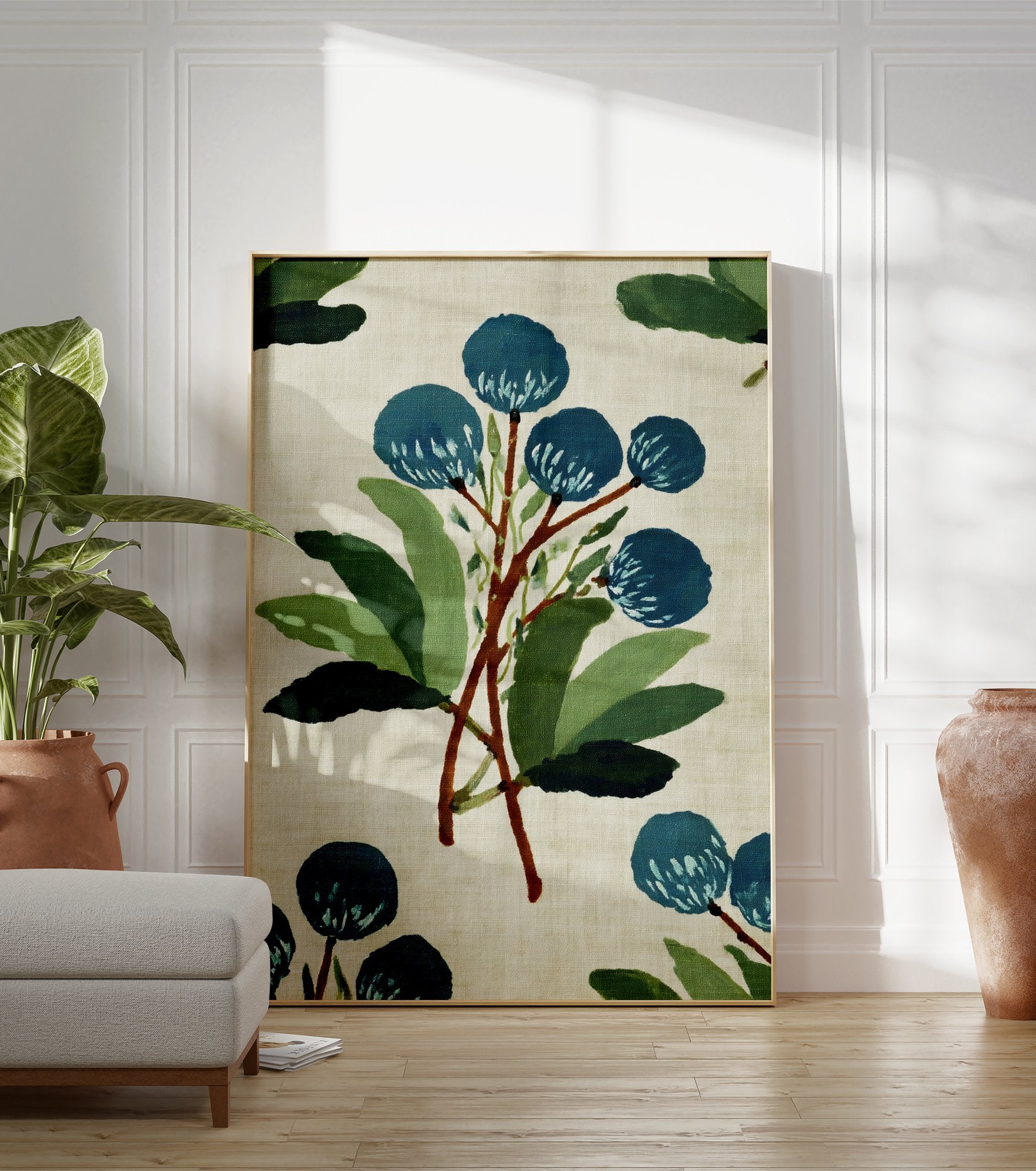 Blue botanical wall art print with painterly style blue flowers and green leaves on a light beige background. - Image 3