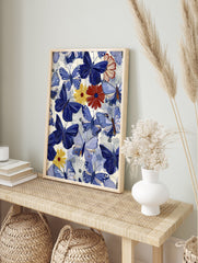 Blue butterfly and colorful floral pattern art print with red, yellow, and white flowers on a light background. - Image 3