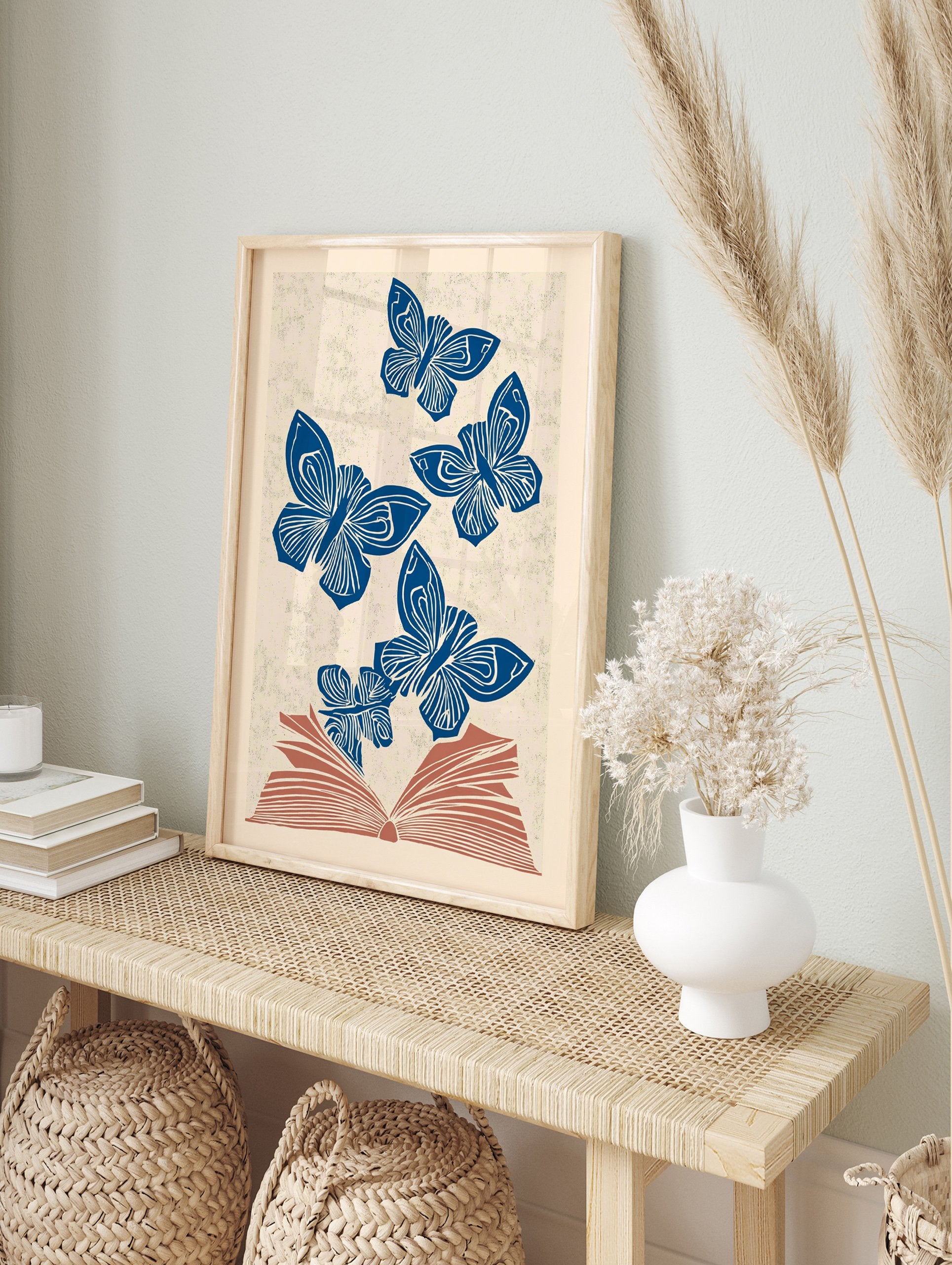 Blue butterfly wall art illustration of multiple butterflies flying out of an open book on a textured beige background. - Image 3