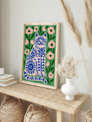 Illustrative blue cat print with floral patterns on a green background, perfect for modern, in an alternate framed mockup