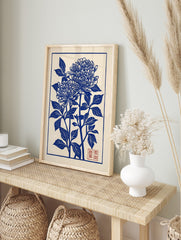 Blue chrysanthemum botanical illustration art print in Japanese woodblock style with red seal, in an alternate framed mockup