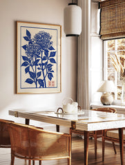 Blue chrysanthemum botanical illustration art print in Japanese woodblock style with red seal, in a styled room mockup