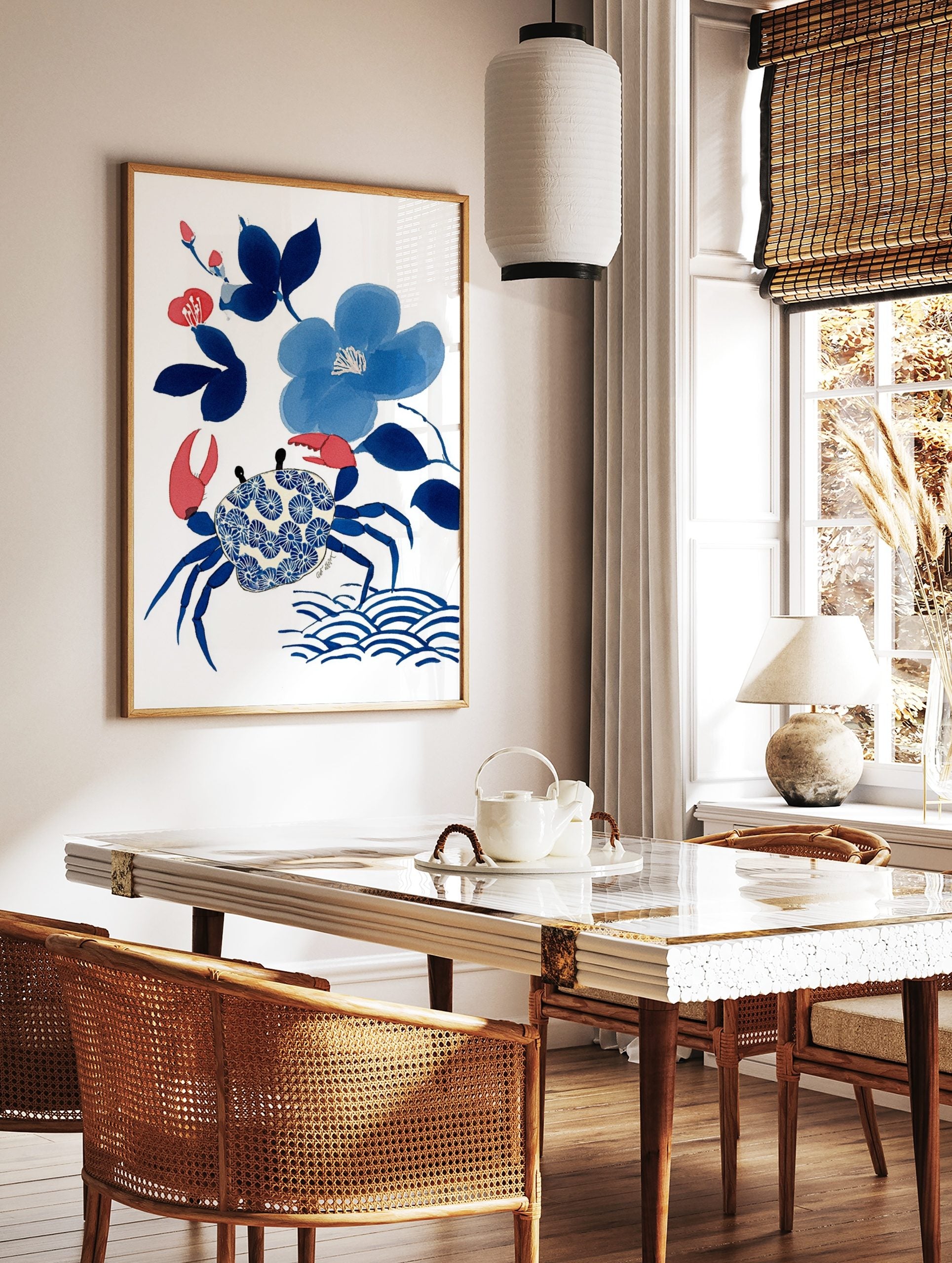 Blue crab with patterned shell, blue flowers, and red buds illustration art print on white, in a styled room mockup