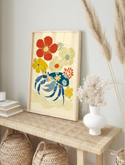 Illustrative art print of a blue crab with floral patterns, surrounded by red and yellow, in an alternate framed mockup