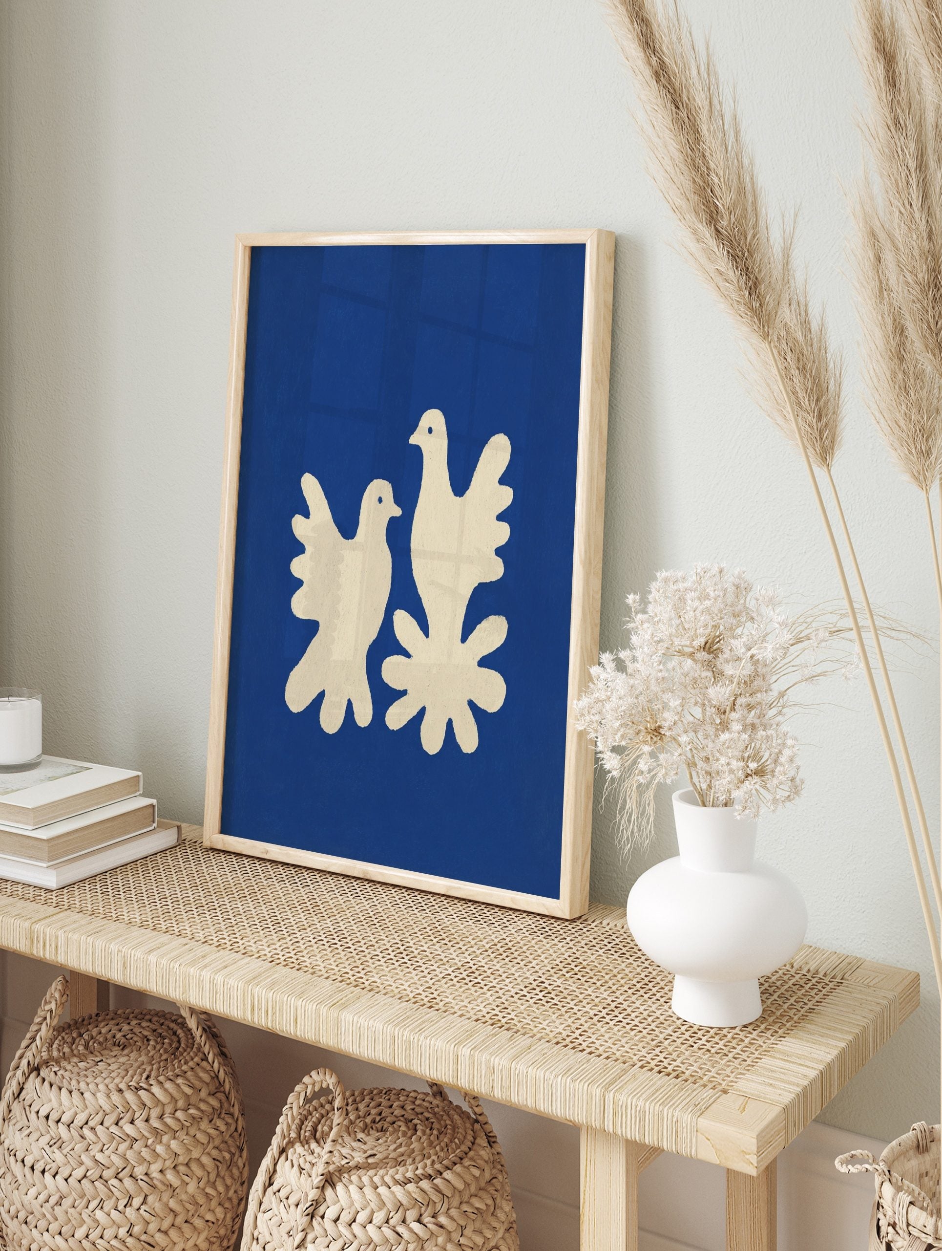 Minimalist art print of two cream doves on a deep blue background with a textured, cut-out, in an alternate framed mockup