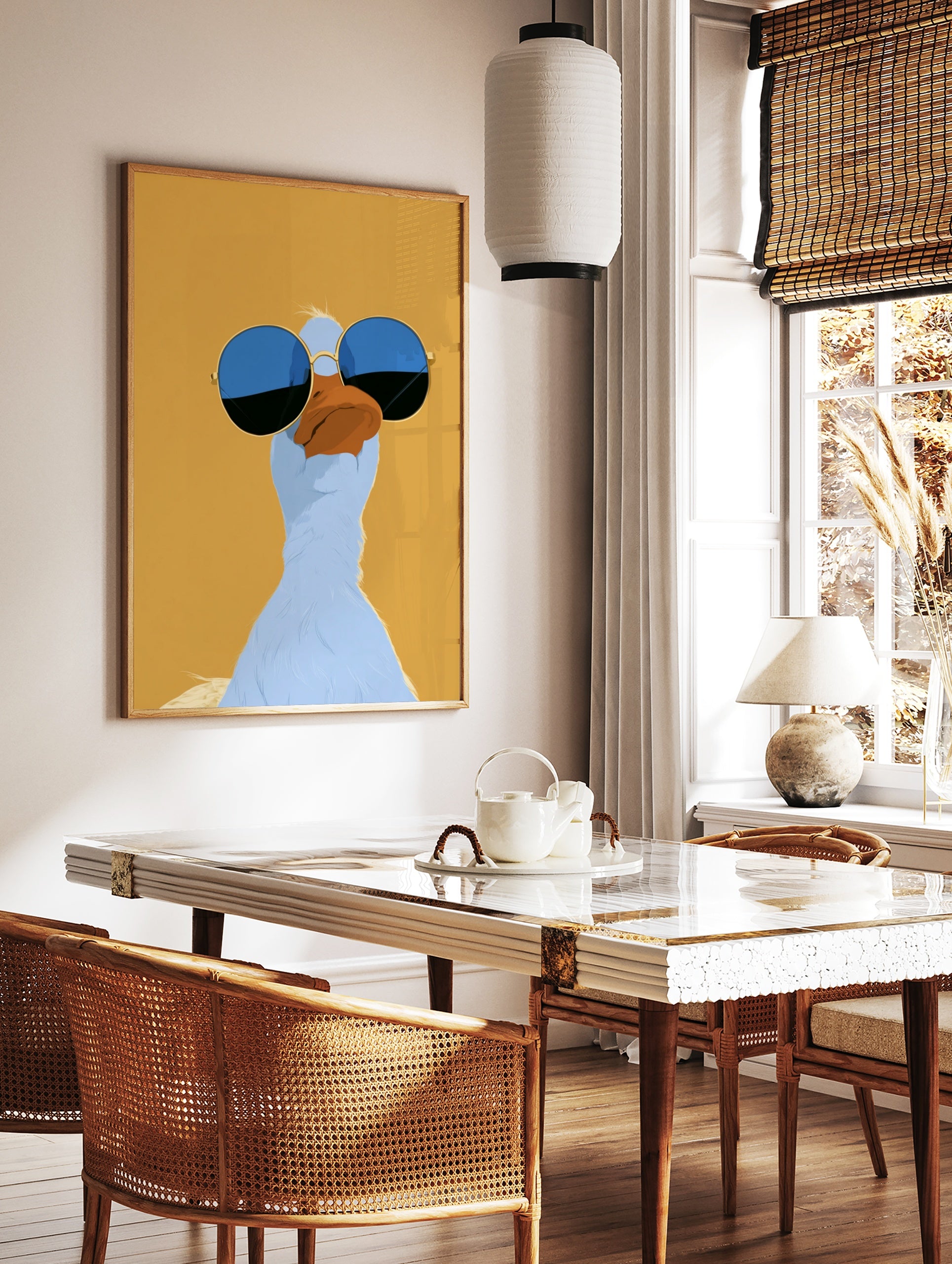Stylized illustrative blue duck wearing round blue-tinted sunglasses on a solid mustard yellow, in a styled room mockup