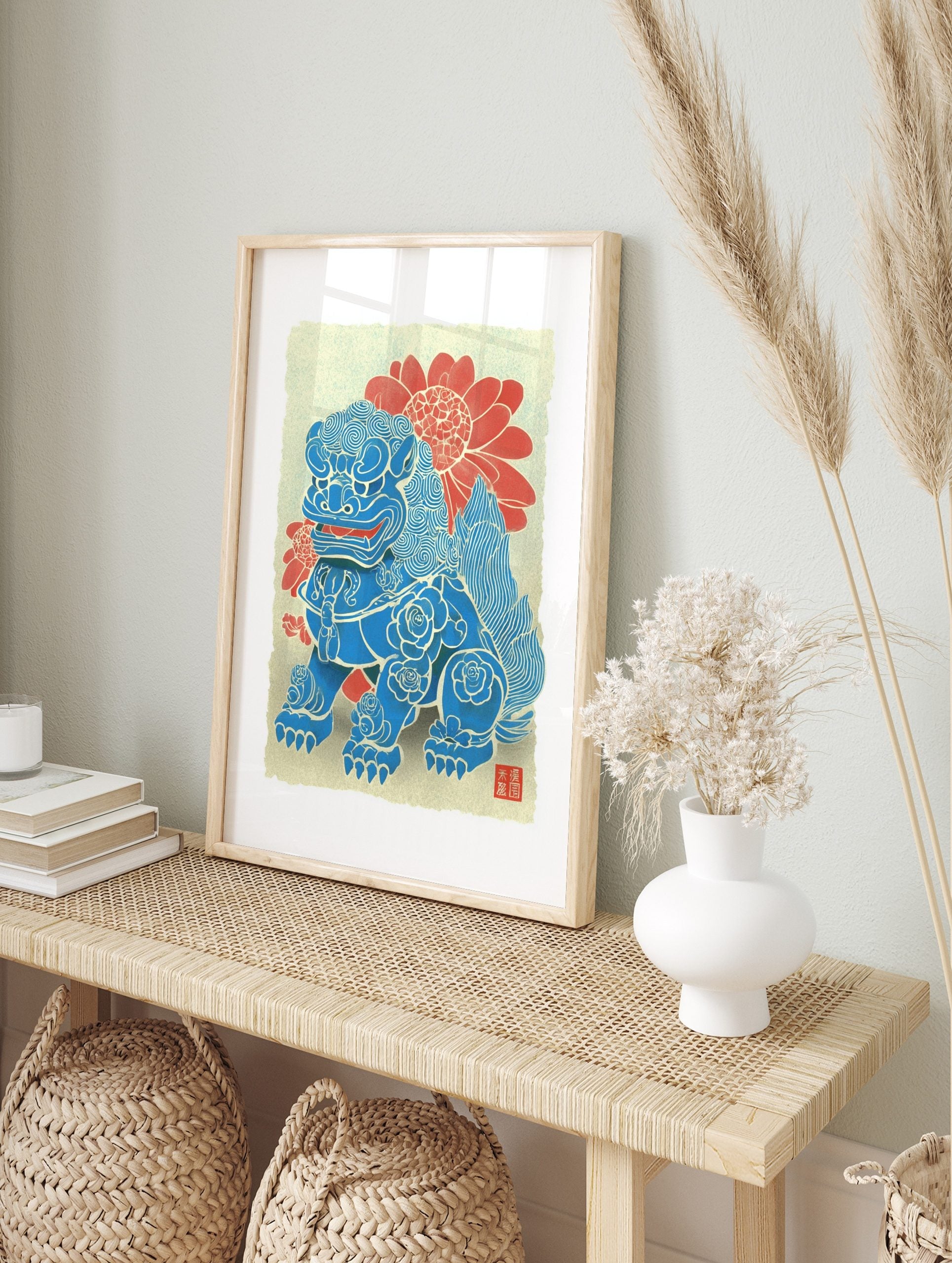Blue Foo Dog guardian lion art print with swirling patterns, rose motifs, red flowers, and, in an alternate framed mockup
