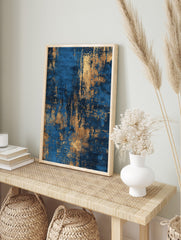 Abstract art print with distressed gold texture over a deep blue background, vertical, in an alternate framed mockup